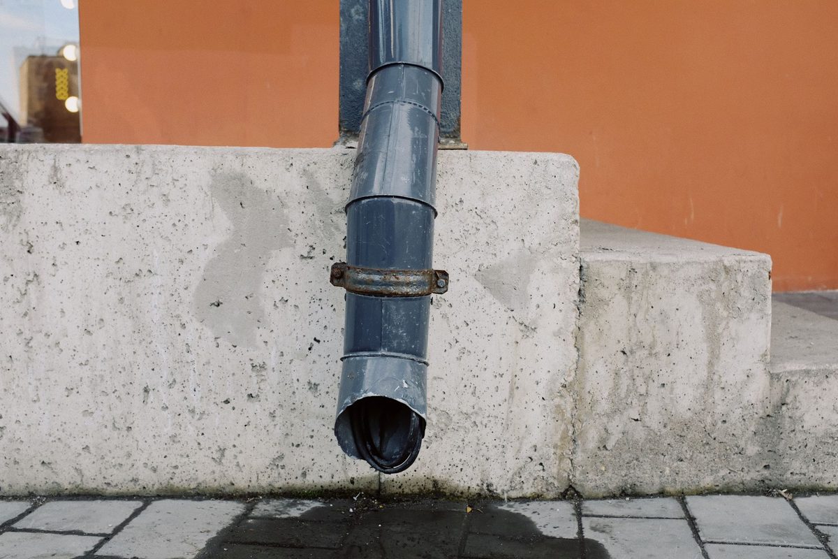 Drain pipe emerging from a concrete wall